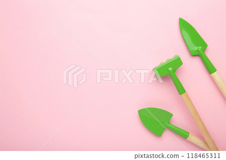 Gardening tools on pink background with copy space. Gardening tools on pink background with copy space. 118465311