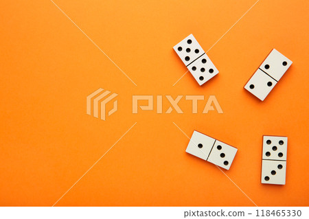 Domino pieces on the orange background with copy space. Game Domino pieces on the orange background with copy space. Game 118465330