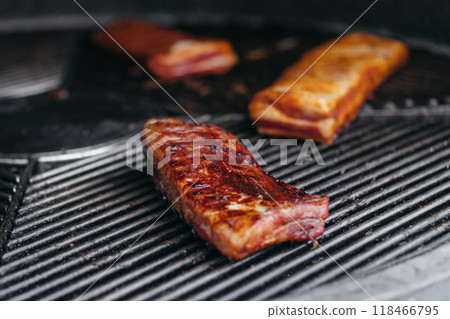 Mouthwatering Rack of Ribs on Round Grill. Glazed Barbecue Meat Over Hot Coals 118466795