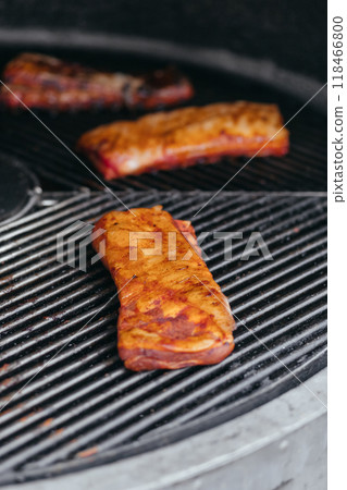 Mouthwatering Rack of Ribs on Round Grill. Glazed Barbecue Meat Over Hot Coals 118466800