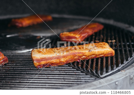 Mouthwatering Rack of Ribs on Round Grill. Glazed Barbecue Meat Over Hot Coals 118466805