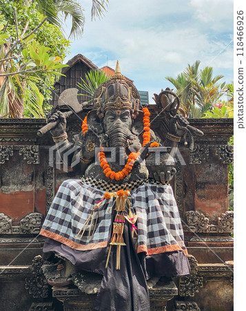 Ganesha with balinese Barong masks sitting on front of temple 118466926