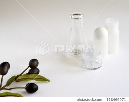 White cosmetic bottles and plants with botanical images 118466971
