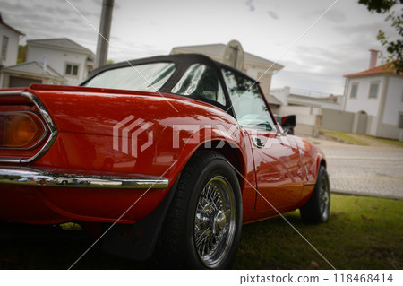 The interior of an old red retro car. Concept of love for retro style, vintage stuff, car enthusiasts The interior of an old red retro car. Concept of love for retro style, vintage stuff, car enthusiasts 118468414