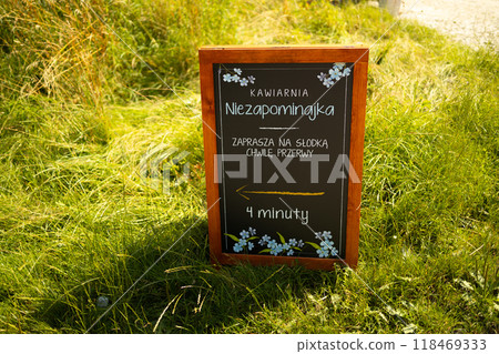 Blank menu blackboard outdoor display for the coffee shop cafe, mock up, cafeteria blurred background Blank menu blackboard outdoor display for the coffee shop cafe, mock up, cafeteria blurred background 118469333