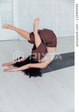 Young yogi woman practicing yoga concept, doing One Legged King Pigeon exercise, Young yogi woman practicing yoga concept, doing One Legged King Pigeon exercise, 118469494