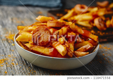 typical german dish currywurst and chips 118471558