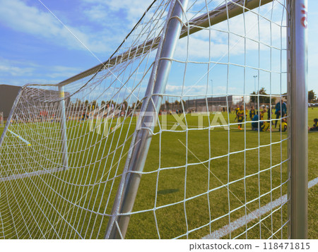 Close up. Soccer player wearing red cleat with small spikes for grip Close up. Soccer player wearing red cleat with small spikes for grip 118471815