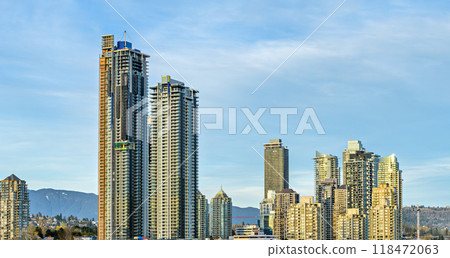 Settled and new high rise residential buildings on blue sky background 118472063