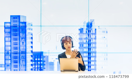 Business woman with headset working in free address office 118473799