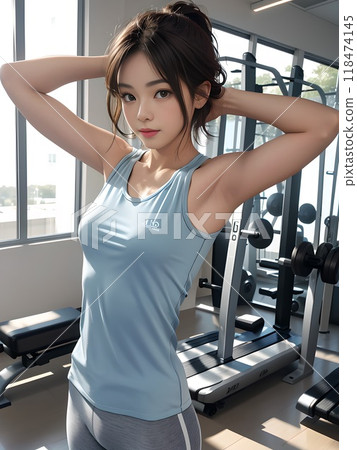 一位女士在健身房開始運動前將長髮紮起來 118474145