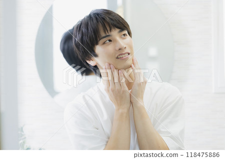 Man doing skin care in the bathroom 118475886