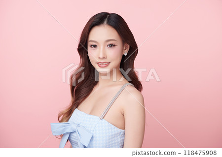 Beautiful young asian woman with clean fresh skin on pink background, Face care, Facial treatment, Cosmetology, beauty and spa, Asian women portrait. Beautiful young asian woman with clean fresh skin on pink background, Face care, Facial treatment, Cosmetology, beauty and spa, Asian women portrait. 118475908