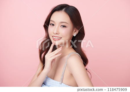 Beautiful young asian woman with clean fresh skin on pink background, Face care, Facial treatment, Cosmetology, beauty and spa, Asian women portrait. 118475909