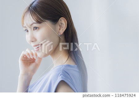Woman in light blue dress Woman in light blue dress 118475924