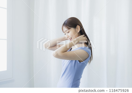 Woman in light blue dress Woman in light blue dress 118475926