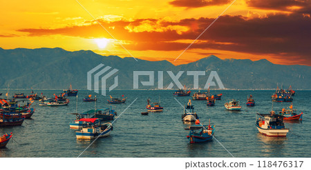 Vietnamese traditional fishing boats in sea at marina at sunset in summer 118476317