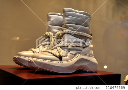 Beige warm comfortable high sole lace-up boots for winter weather on storefront Beige warm comfortable high sole lace-up boots for winter weather on storefront 118476669