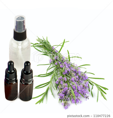 Lavender essential oil in bottles and bouquet of lavender flowers isolated on white. Free space for text. Collage. 118477226