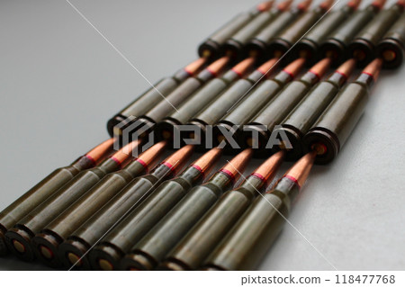 Live Ammunition For The Assault Rifle Is Laid Out In Rows Isolated Stock Photo Live Ammunition For The Assault Rifle Is Laid Out In Rows Isolated Stock Photo 118477768