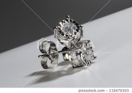 Diamond earrings. Big diamond earrings, large solitaire earrings on white background. 118478303