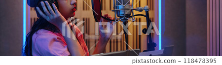 Recording Song in Professional Music Studio Booth 118478395