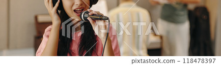 Singing Girl Wearing Headphones Holding Microphone Singing Girl Wearing Headphones Holding Microphone 118478397
