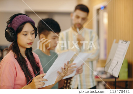 Preparing for Music Class Assignment in Study Room 118478481