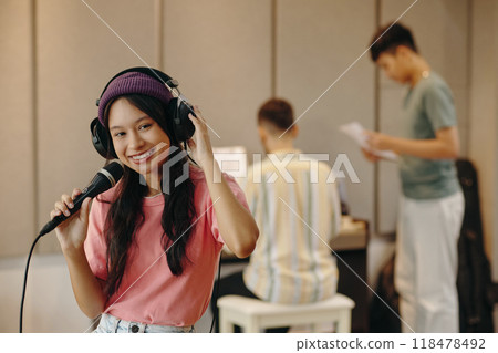 Singing Practice Session with Friends at Music Studio Singing Practice Session with Friends at Music Studio 118478492