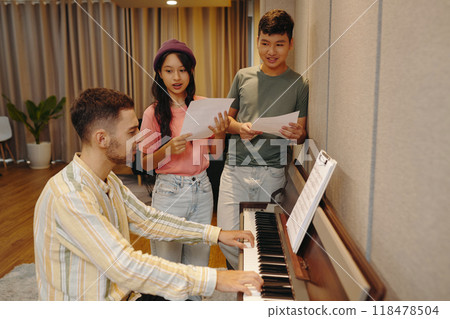 Group Practicing Music Together at Piano Group Practicing Music Together at Piano 118478504