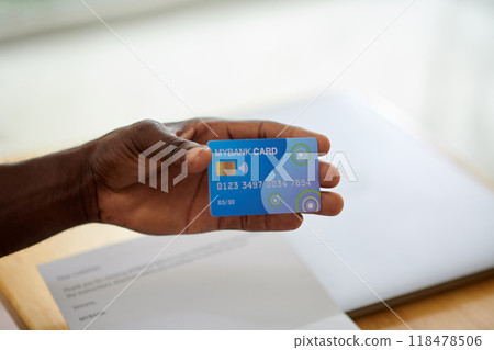 Portrait of Man Playing Acoustic Guitar in Music Studio Setting 118478506