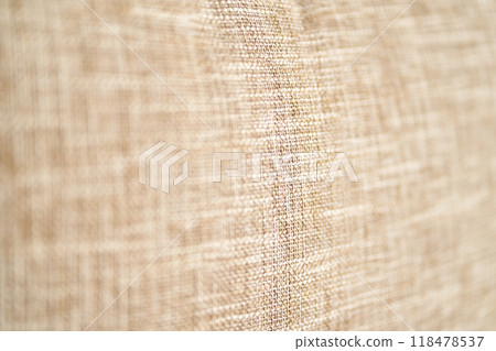 Close-up texture of beige linen fabric with woven patterns and natural fibers Close-up texture of beige linen fabric with woven patterns and natural fibers 118478537
