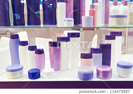 Shop showcase with plastic cosmetic bottles and shampoo Shop showcase with plastic cosmetic bottles and shampoo 118478897