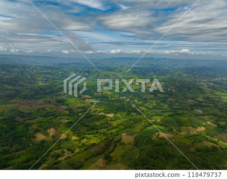 Mountains with green hills and farmlands. Mindanao, Philippines. Mountains with green hills and farmlands. Mindanao, Philippines. 118479737