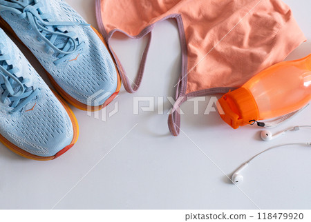 flat lay with sport wear, shoes and earphone flat lay with sport wear, shoes and earphone 118479920