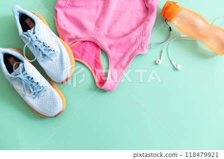 Flat lay with sport equipment on light green background 118479921