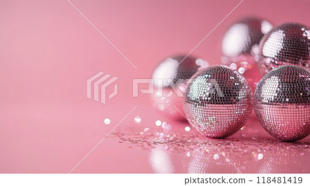Shiny disco balls arranged elegantly against a soft pink background in a modern setting 118481419