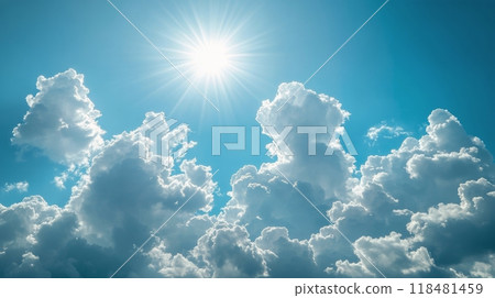 Fluffy white clouds scattered across a bright blue sky on a sunny day in mid-afternoon 118481459