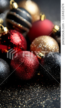Sparkling red and black Christmas ornaments arranged on a festive dark background 118481474