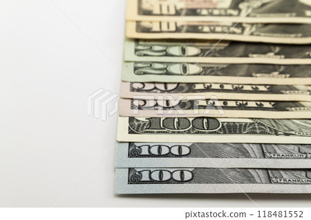 US american dollar money bills spread on white background 118481552