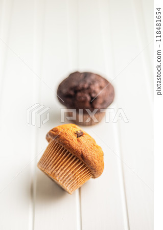 Sweet muffin cakes on white table. Sweet muffin cakes on white table. 118481654