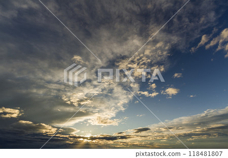 Fantastic panorama view of bright white gray dark wide puffy clouds lit by sun spreading against deep blue sky moving with wind. Beauty and power of nature, meteorology and climate changing concept. Fantastic panorama view of bright white gray dark wide puffy clouds lit by sun spreading against deep blue sky moving with wind. Beauty and power of nature, meteorology and climate changing concept. 118481807