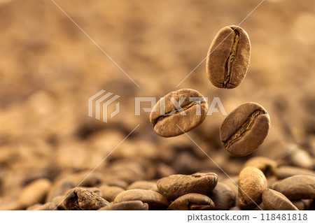 Flying fresh coffee beans as a background with copy space. Coffee beans falling down 118481818