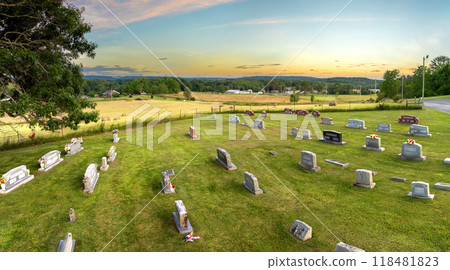 Graveyard burial place with many tombstones at small American church yard 118481823