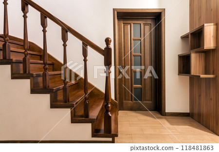 Modern brown oak wooden stairs and doors in new renovated house interior 118481863