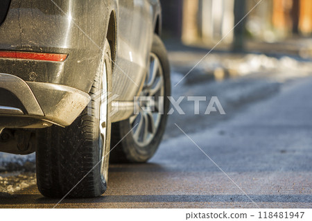Close-up of dirty car parked on a side of the street 118481947