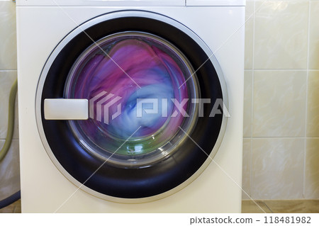 Colorful clothes and towels in washing machine 118481982