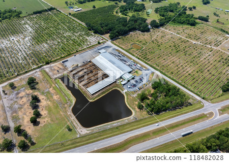 Aerial view of feed yard with meat cows. Feeding of cattle on farm feedlot 118482028