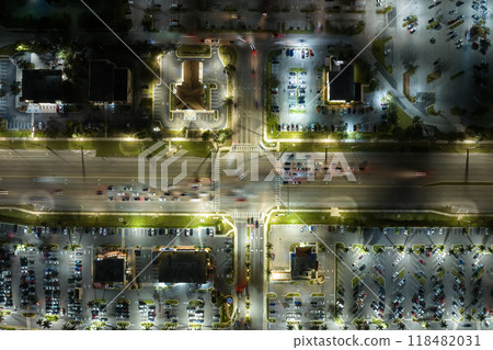 Aerial view of shopping plaza stores and American wide highway with many driving cars in North Port, Florida Aerial view of shopping plaza stores and American wide highway with many driving cars in North Port, Florida 118482031
