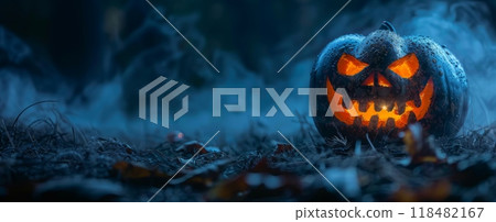 Halloween, the spookiest day of the year. A menacing jack-o'-lantern, its glowing eyes and jagged grin carved into a pumpkin, casting an eerie glow. 118482167
